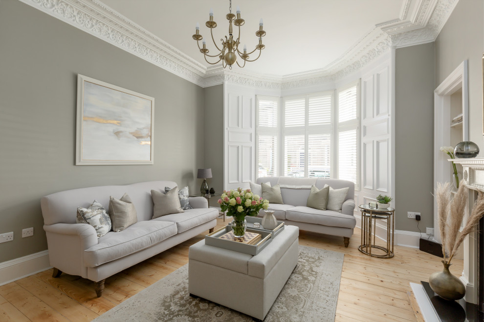 Example of a classic living room design in Edinburgh with a standard fireplace and no tv