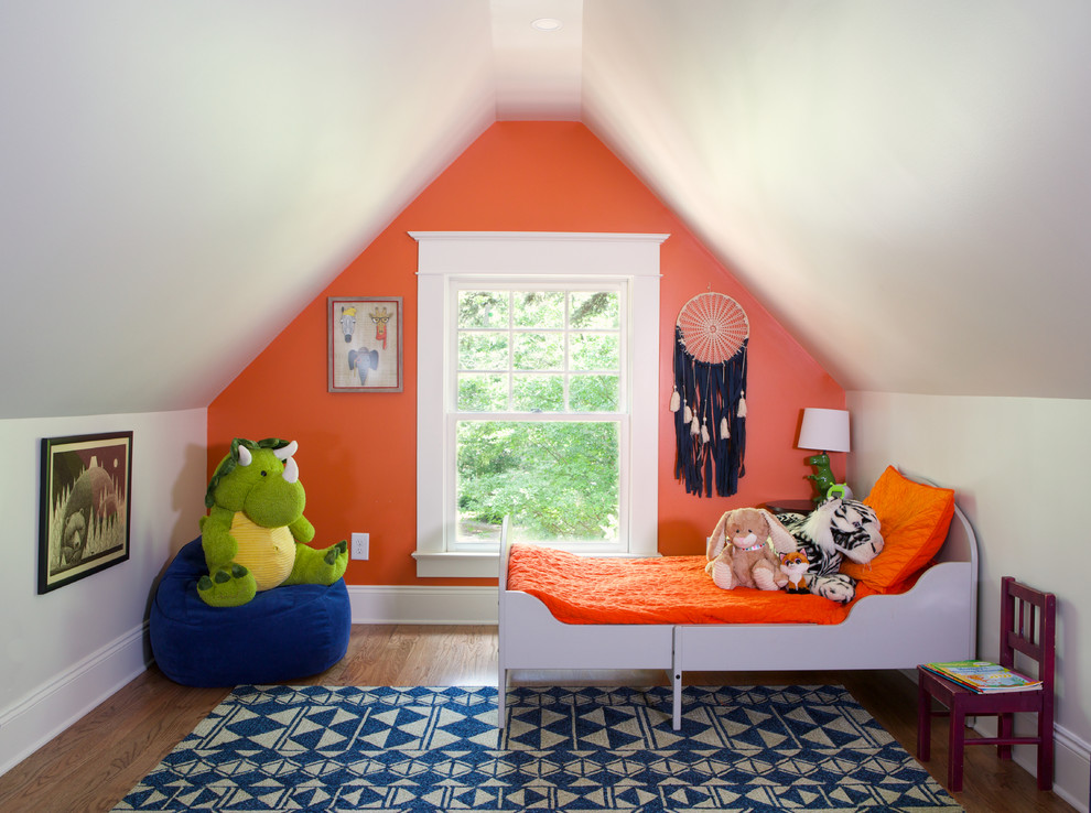 Design ideas for a mid-sized transitional kids' room for boys in Atlanta with orange walls, medium hardwood floors and brown floor.