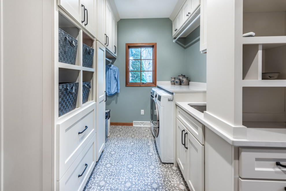 Small transitional galley utility room in Other with an utility sink, shaker cabinets, white cabinets, quartzite benchtops, vinyl floors, a side-by-side washer and dryer and white benchtop.