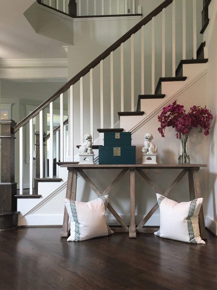 Example of a large dark wood floor and brown floor foyer design in DC Metro with gray walls and a brown front door