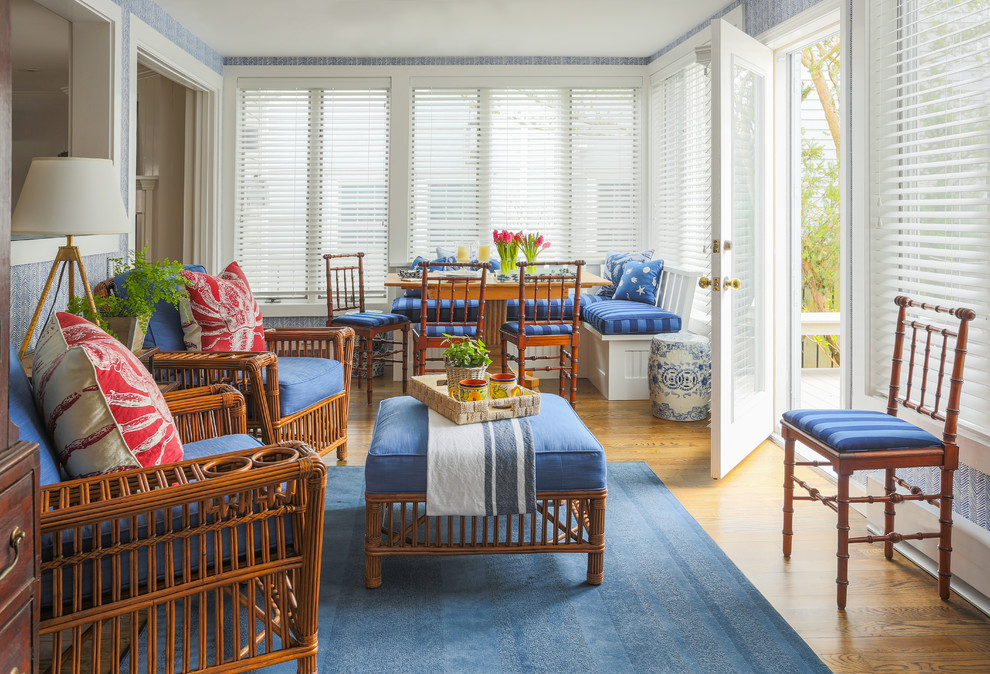 Photo of a mid-sized traditional sunroom in Boston with medium hardwood floors and a standard ceiling.