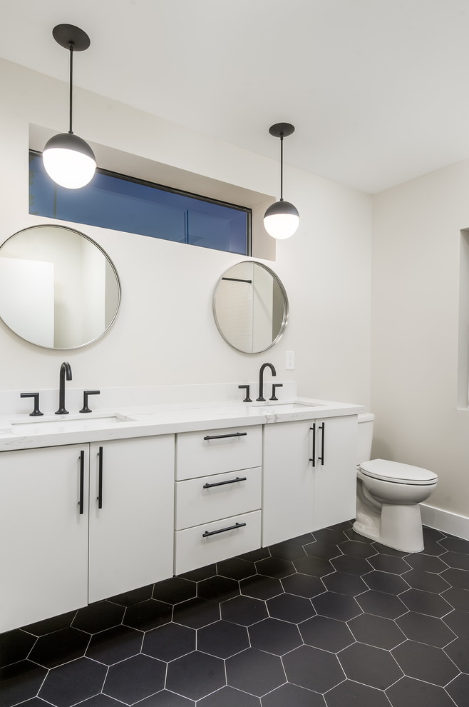 Inspiration for a contemporary kids bathroom in Phoenix with flat-panel cabinets, white cabinets, a freestanding tub, black and white tile and engineered quartz benchtops.