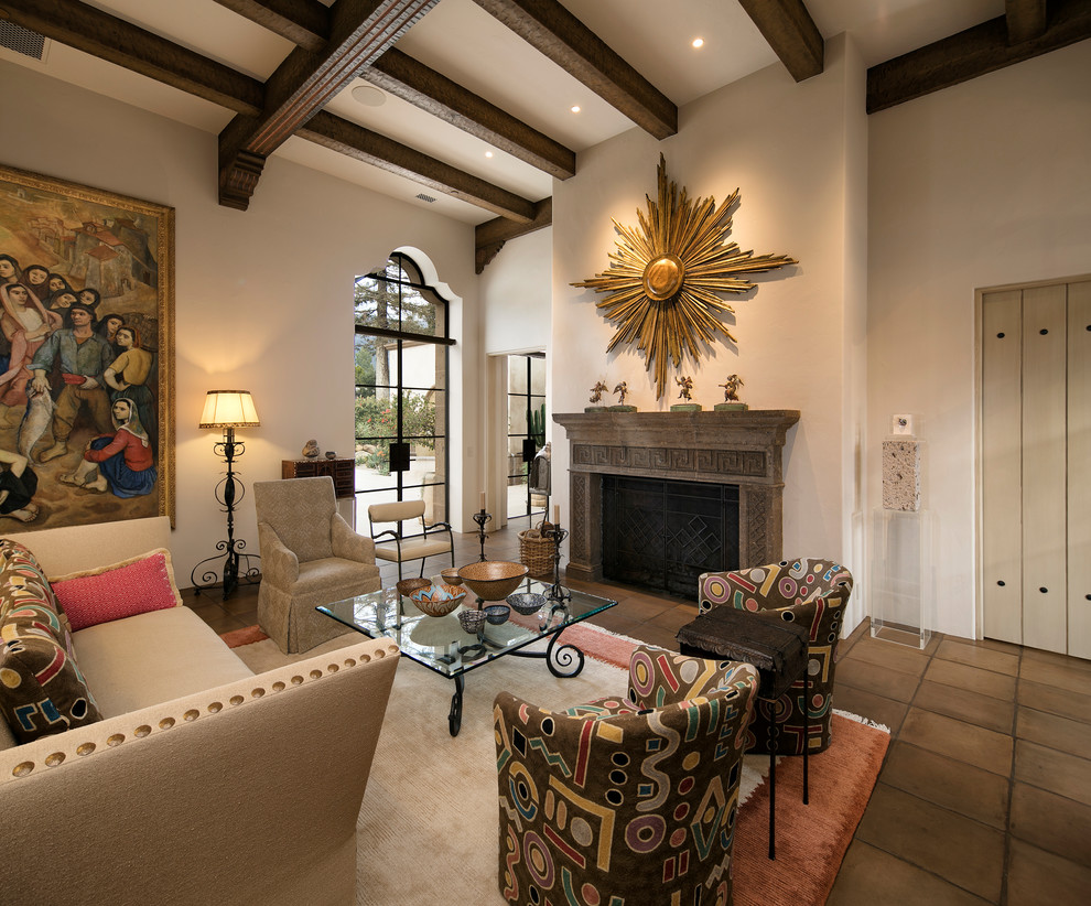 Large mediterranean open concept living room in Santa Barbara with a home bar, beige walls, terra-cotta floors, a standard fireplace, a stone fireplace surround and no tv.