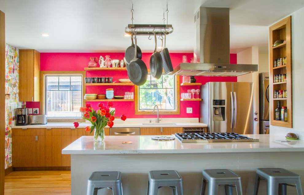 Inspiration for a mid-sized eclectic light wood floor open concept kitchen remodel in Los Angeles with an undermount sink, flat-panel cabinets, light wood cabinets, marble countertops and stainless steel appliances