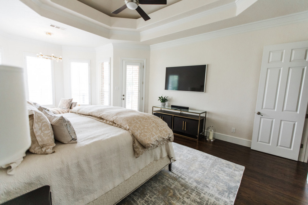 Large traditional master bedroom in Dallas with beige walls, dark hardwood flooring, brown floors and a drop ceiling.