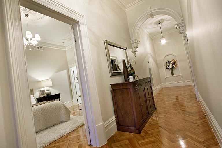 Design ideas for a traditional hallway in Melbourne with medium hardwood floors.