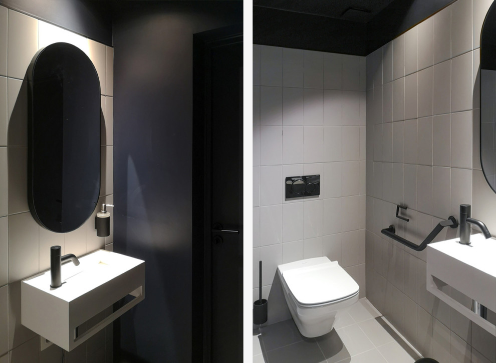 Immagine di un bagno di servizio contemporaneo di medie dimensioni con WC sospeso, piastrelle grigie, piastrelle in ceramica, pavimento con piastrelle in ceramica, lavabo sospeso e pavimento grigio