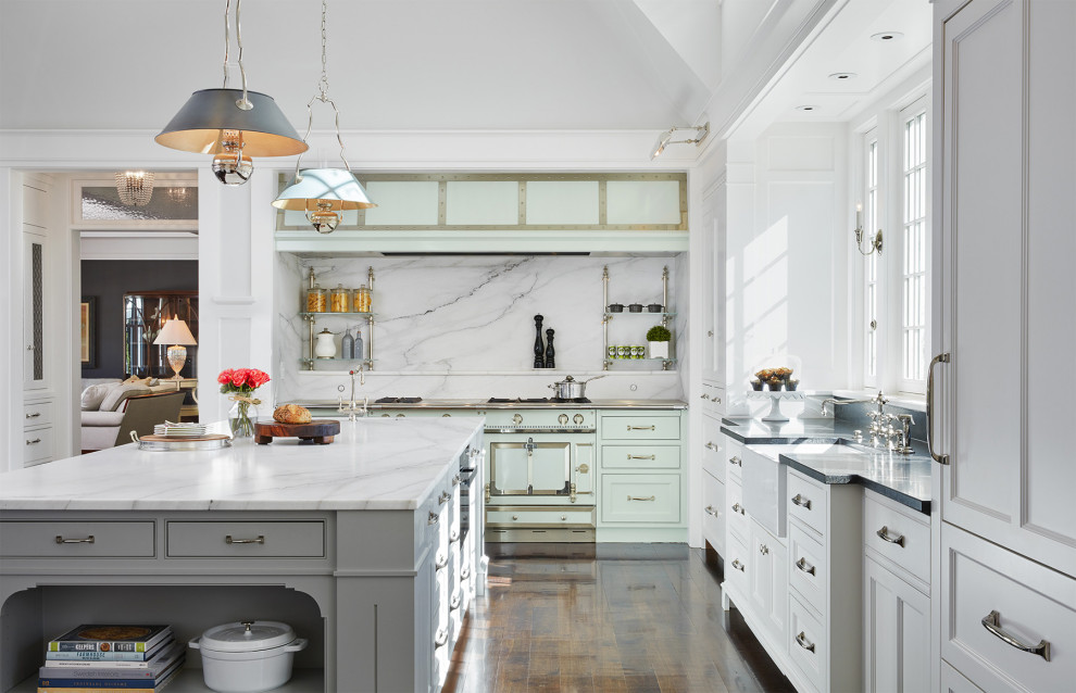 Inspiration for a traditional l-shaped kitchen in Minneapolis with a farmhouse sink, beaded inset cabinets, white cabinets, white splashback, stone slab splashback, coloured appliances, dark hardwood floors, with island, brown floor, white benchtop and vaulted.