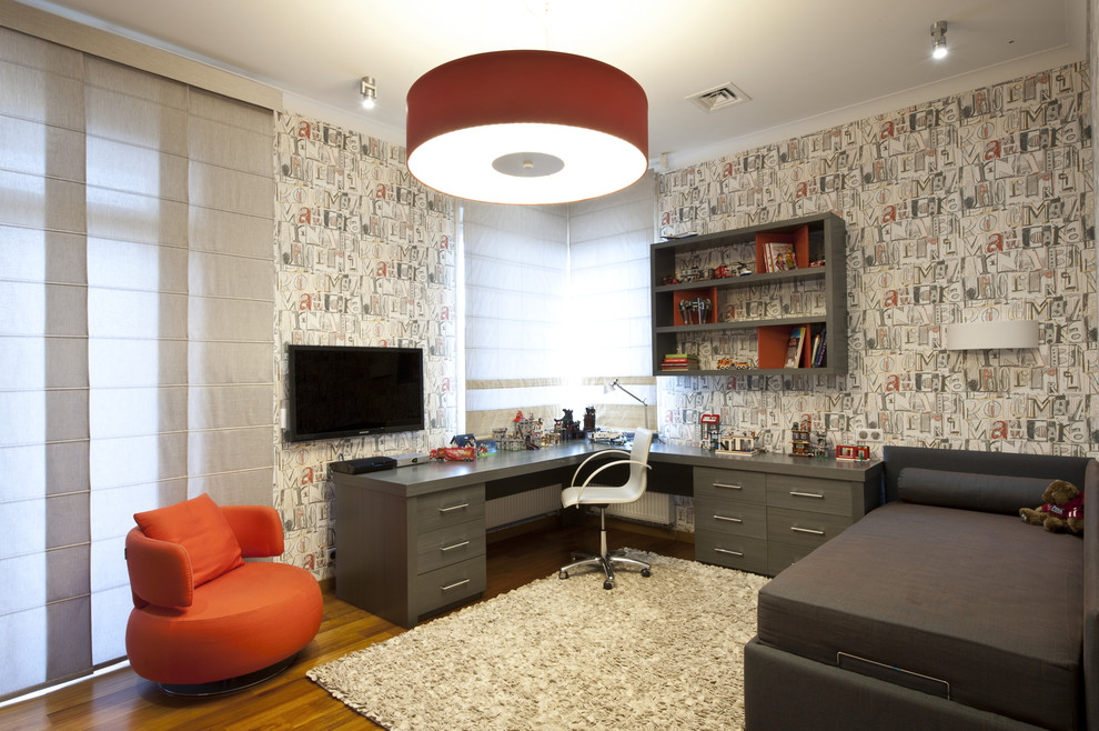 This is an example of a contemporary kids' study room in Moscow with multi-coloured walls.