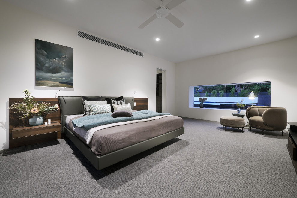 Photo of a modern master bedroom in Perth with carpet.