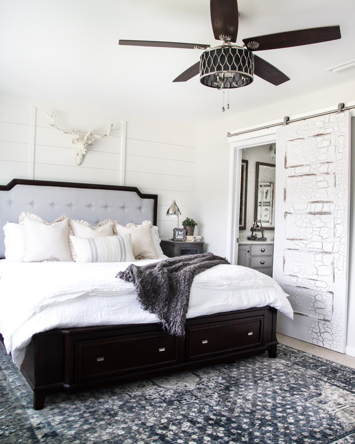 Inspiration for a country master bedroom in Los Angeles with white walls, carpet and no fireplace.