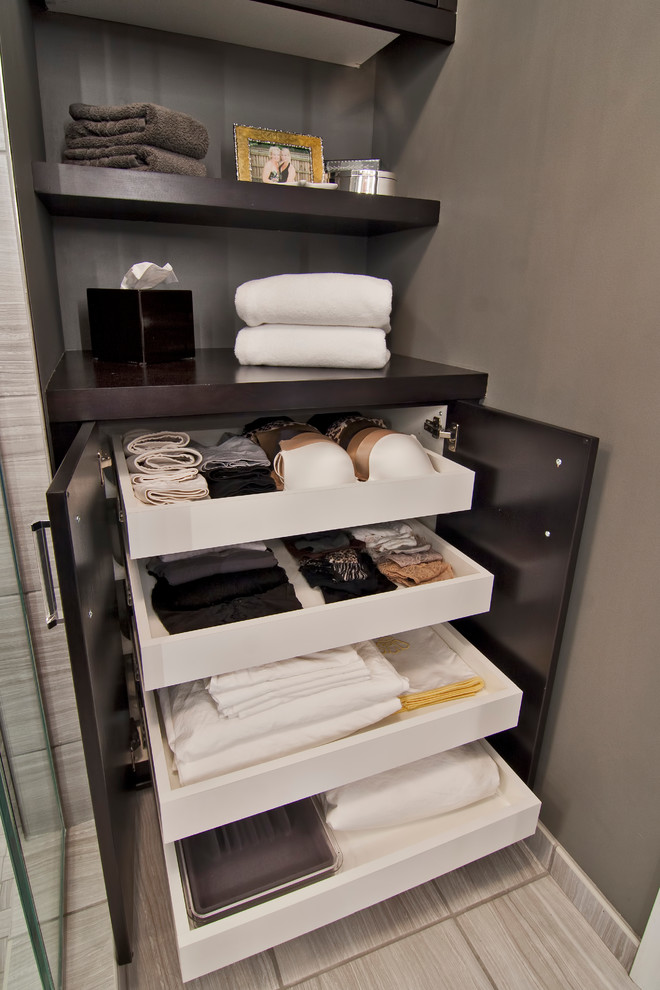 Example of a large transitional master beige tile and ceramic tile ceramic tile and beige floor alcove shower design in Minneapolis with flat-panel cabinets, black cabinets, a one-piece toilet, gray walls, an undermount sink, quartz countertops and white countertops