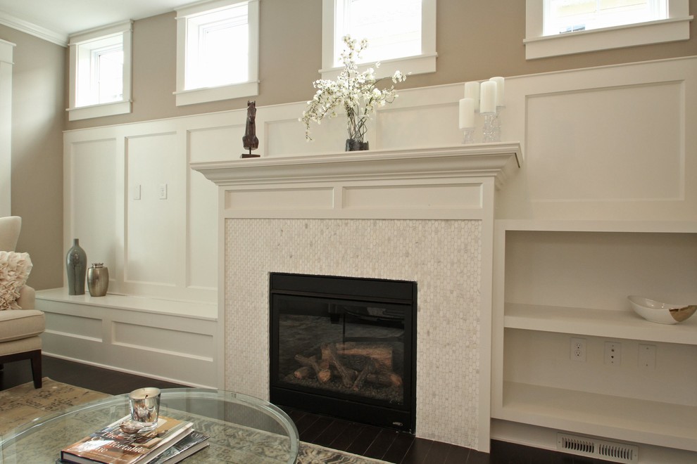 This is an example of a mid-sized transitional formal open concept living room in Cedar Rapids with grey walls, dark hardwood floors, a standard fireplace and a stone fireplace surround.