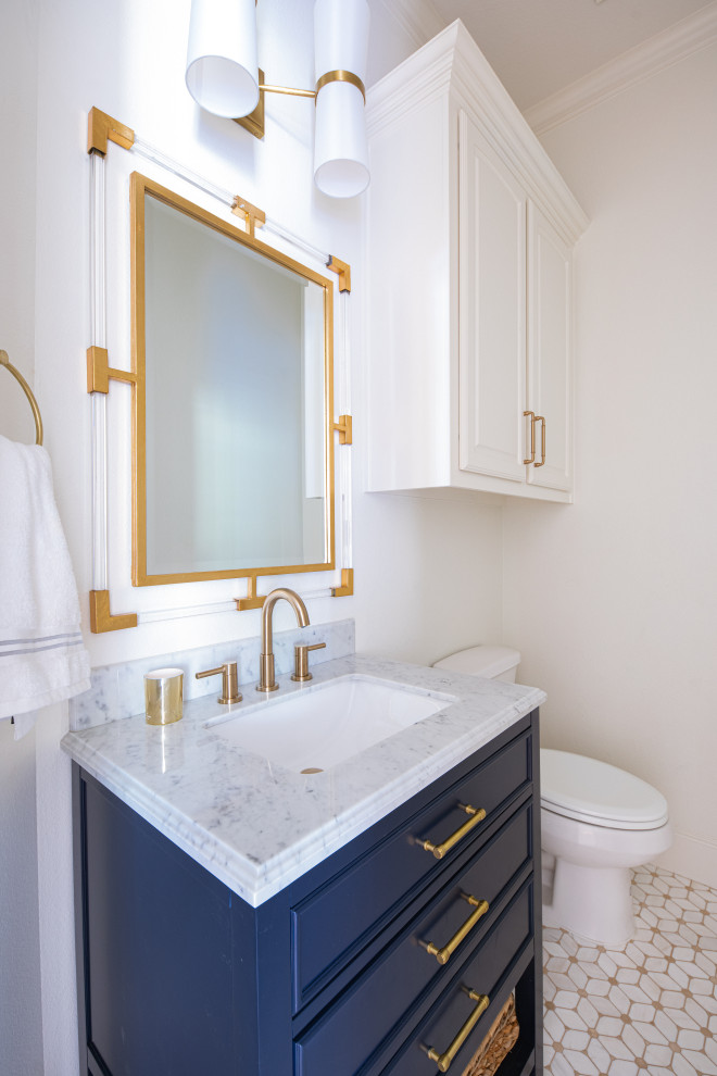 Photo of a small transitional bathroom in Dallas with blue cabinets, white walls, mosaic tile floors, an undermount sink, marble benchtops, white benchtops, a single vanity and a freestanding vanity.