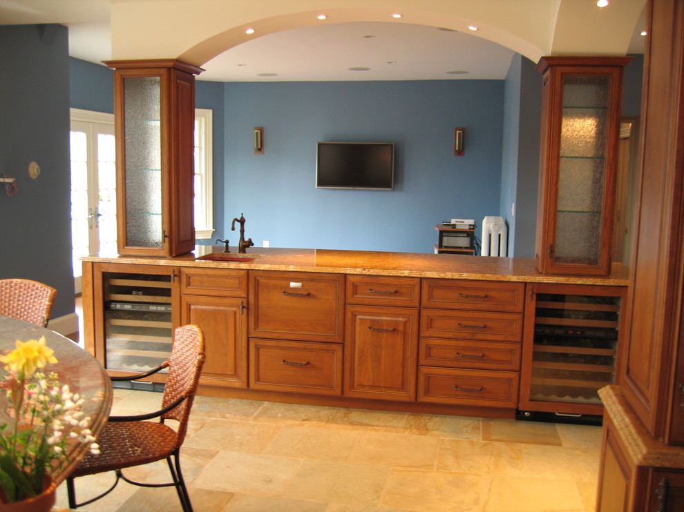 Design ideas for a large traditional u-shaped open plan kitchen in Boston with an undermount sink, raised-panel cabinets, medium wood cabinets, granite benchtops, panelled appliances, terra-cotta floors and multiple islands.