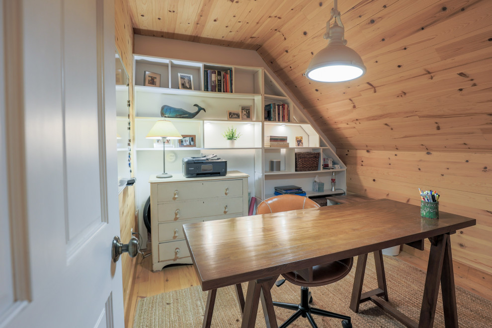 Example of a beach style home office design in Portland Maine