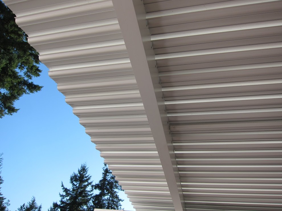 Inspiration for a mid-sized transitional backyard patio remodel in Phoenix with a roof extension