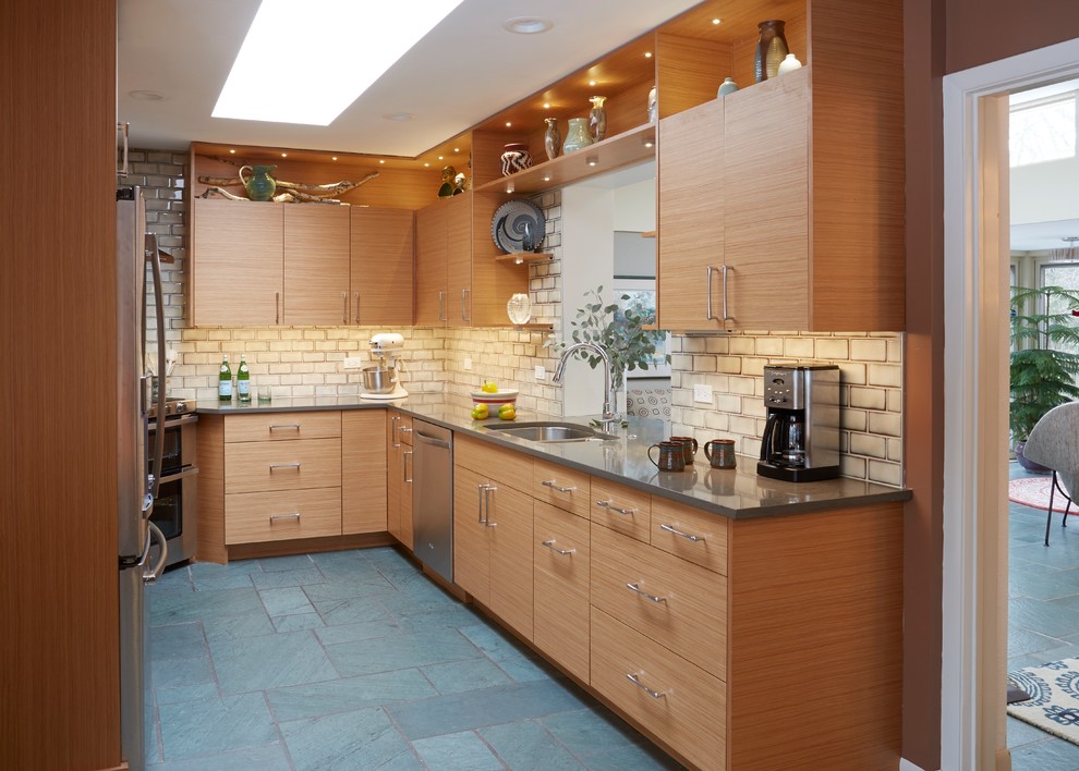 Inspiration for a mid-sized midcentury galley separate kitchen in Chicago with a double-bowl sink, flat-panel cabinets, medium wood cabinets, quartz benchtops, beige splashback, subway tile splashback, stainless steel appliances, slate floors, no island and blue floor.