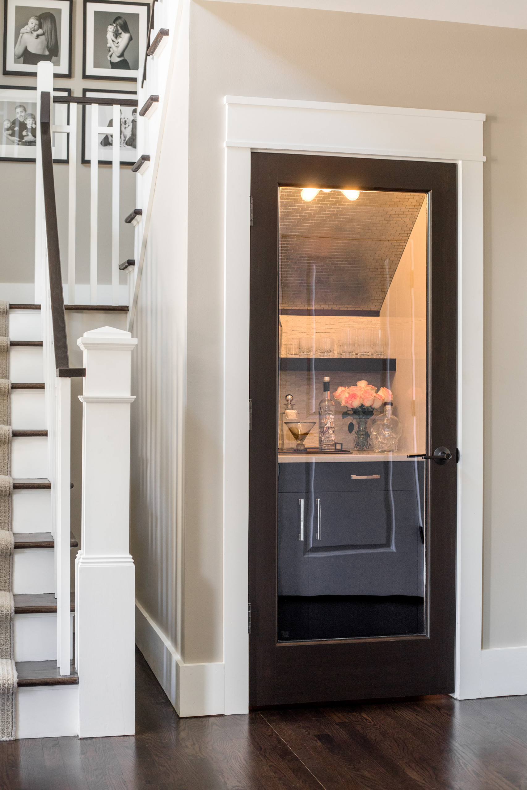 Entryway - small contemporary dark wood floor entryway idea in Detroit with beige walls and a dark wood front door