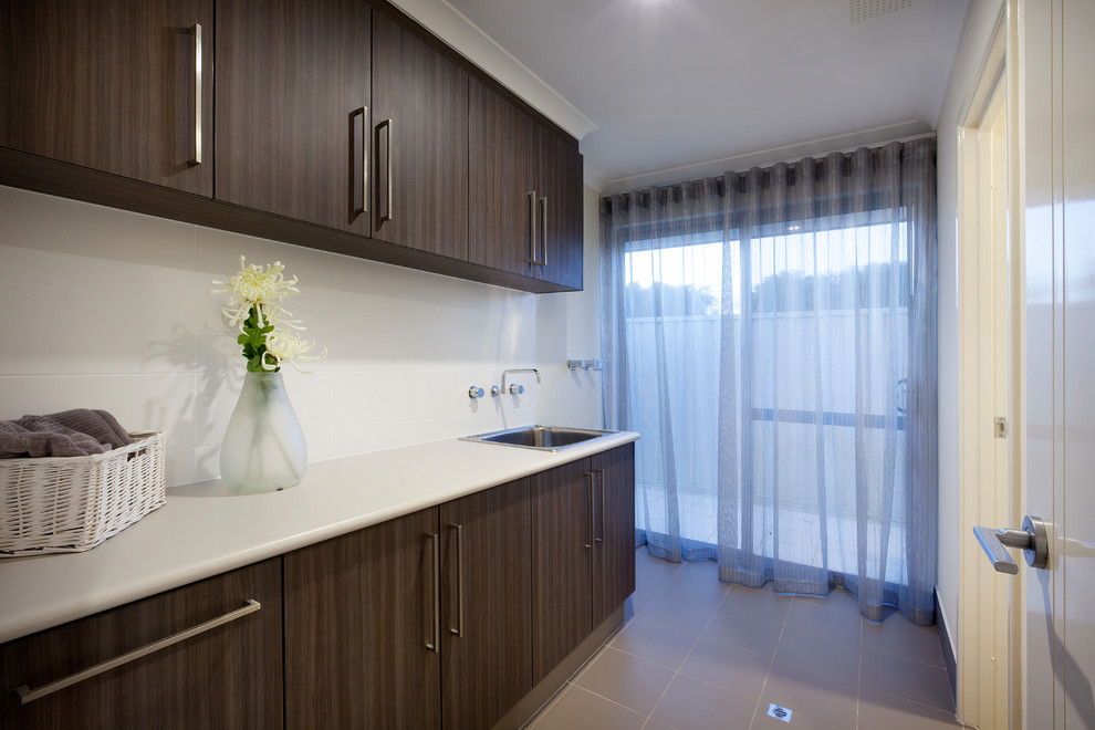 Transitional laundry room in Perth.