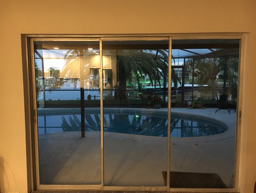 Suggestions for 3 sliding glass door...curtains or blinds? What is mos - Need help with what covering to use for triple sliding glass door.