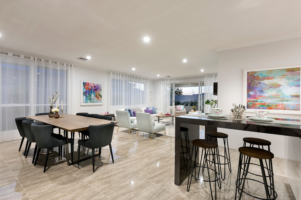 This is an example of a mid-sized modern open concept living room in Perth with white walls, porcelain floors and a wall-mounted tv.