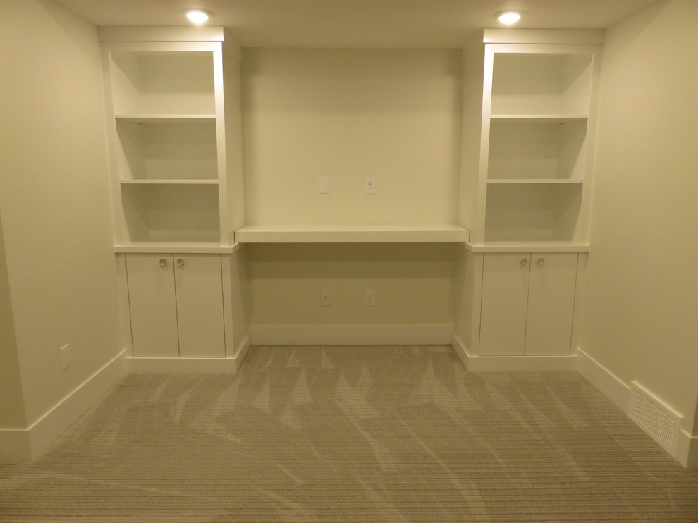 Mid-sized transitional look-out carpeted and gray floor basement photo in Calgary with white walls