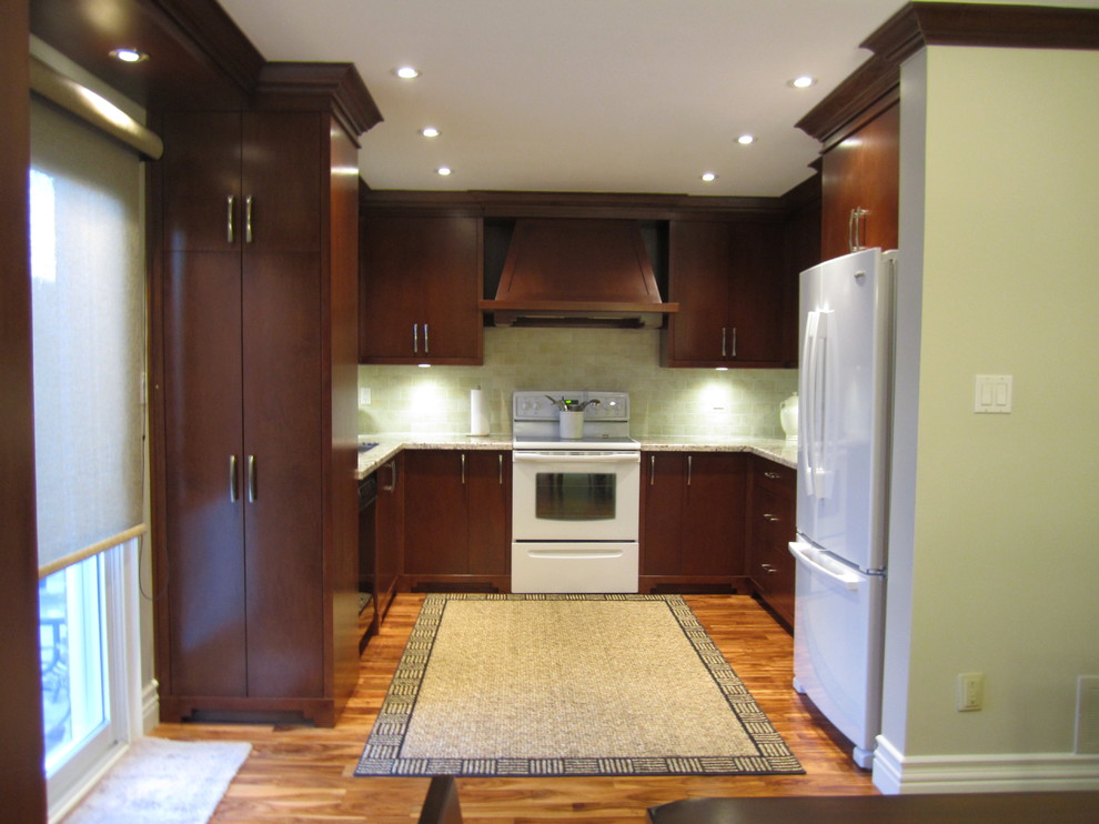 Inspiration for a large transitional u-shaped eat-in kitchen in Toronto with an undermount sink, recessed-panel cabinets, medium wood cabinets, granite benchtops, beige splashback, ceramic splashback, stainless steel appliances and light hardwood floors.