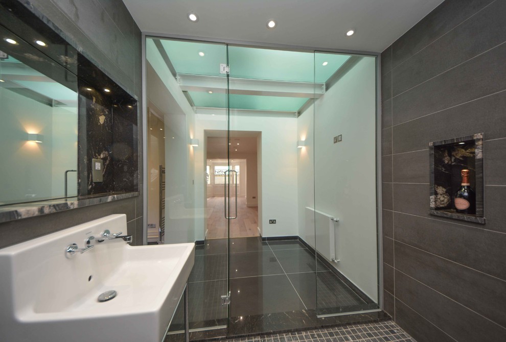 This is an example of an expansive contemporary bathroom in Kent with white walls.