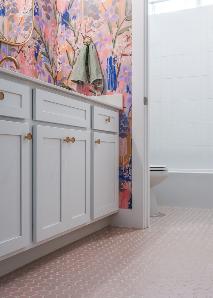 This is an example of a medium sized classic bathroom in Austin with shaker cabinets, white cabinets, a built-in bath, a shower/bath combination, white tiles, ceramic tiles, white walls, ceramic flooring, a submerged sink, engineered stone worktops, pink floors, a shower curtain, white worktops, a wall niche, a single sink and a built in vanity unit.