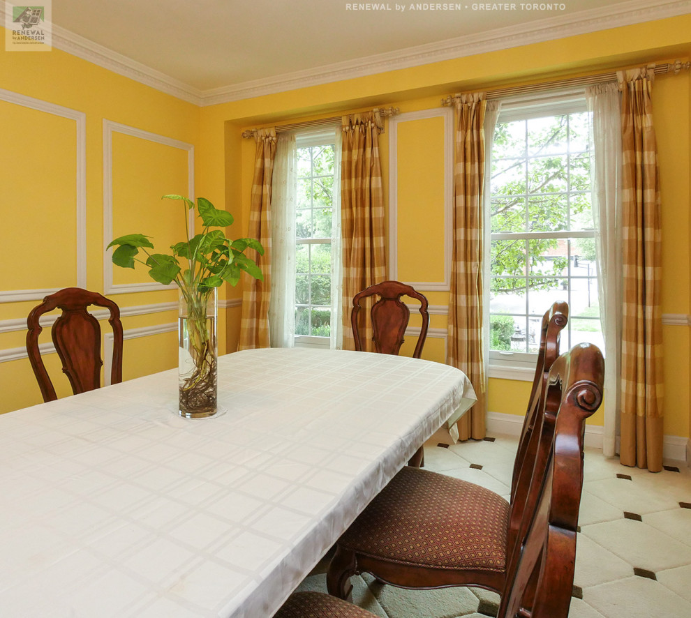 Photo of a mid-sized separate dining room in Toronto with yellow walls, carpet, no fireplace, multi-coloured floor and decorative wall panelling.