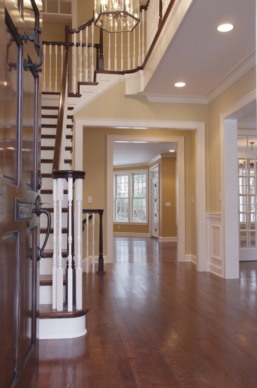 Design ideas for a traditional wood staircase in Kansas City with wood risers.
