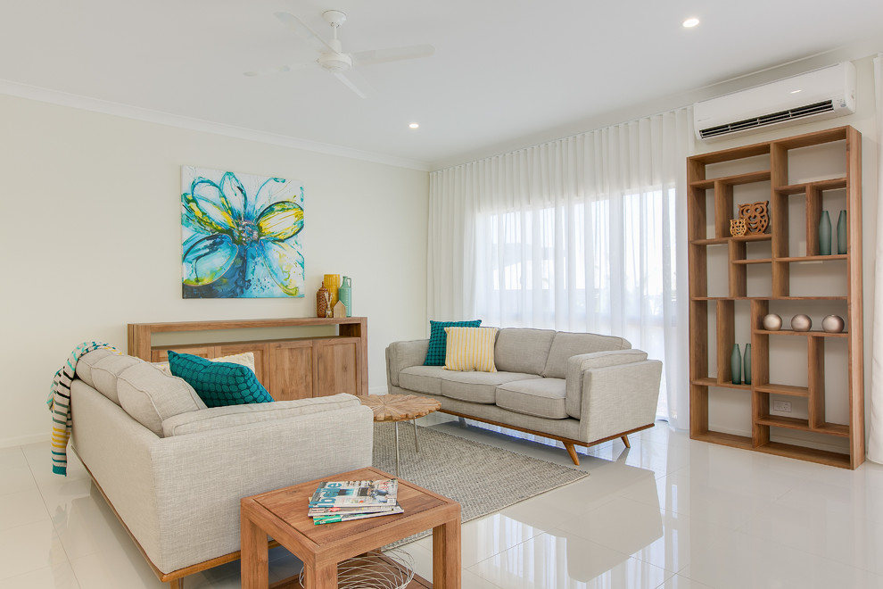 This is an example of a contemporary living room in Cairns with white walls and no tv.