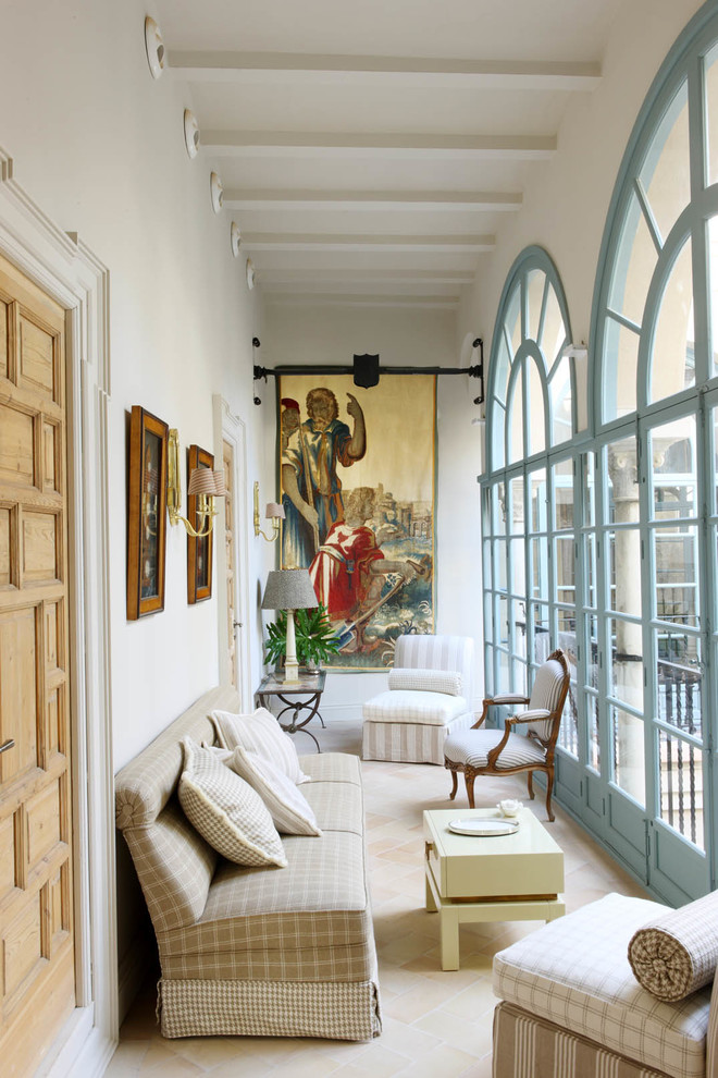 Design ideas for a large mediterranean sunroom in Seville with a standard ceiling, travertine floors and no fireplace.
