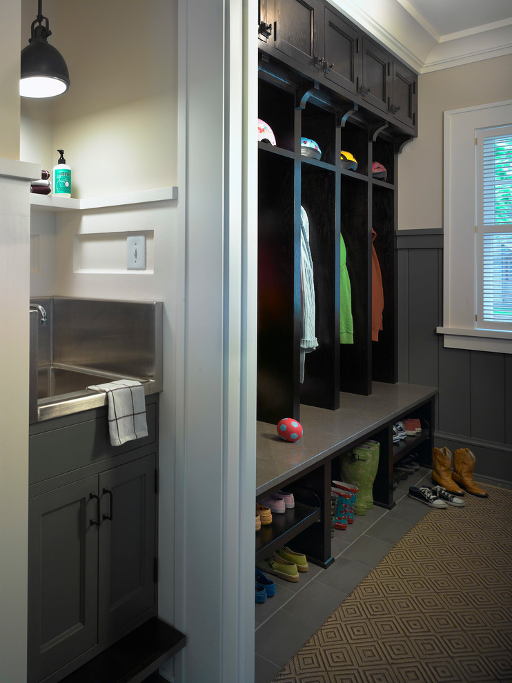 This is an example of a traditional mudroom in Minneapolis with white walls and grey floor.