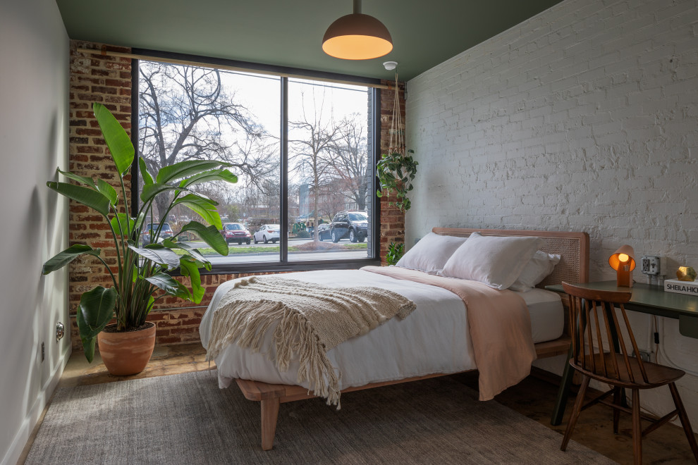 Inspiration for an industrial bedroom remodel in Raleigh
