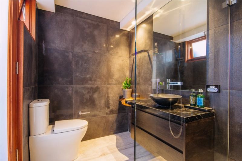 Inspiration for a contemporary bathroom in Sydney with black tile.