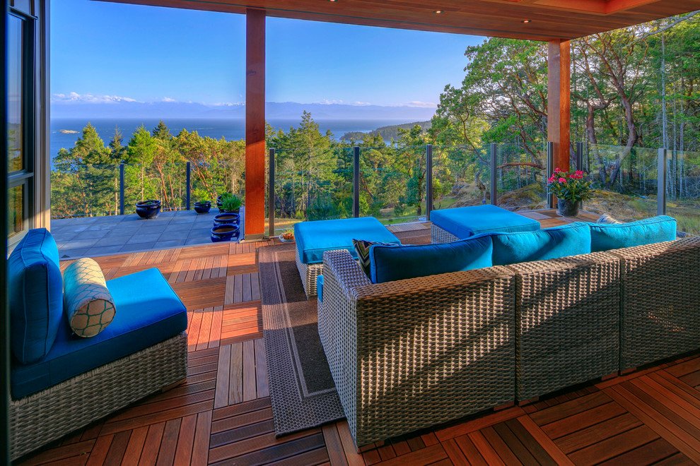 Example of a mid-sized beach style backyard outdoor kitchen deck design in Vancouver with a roof extension