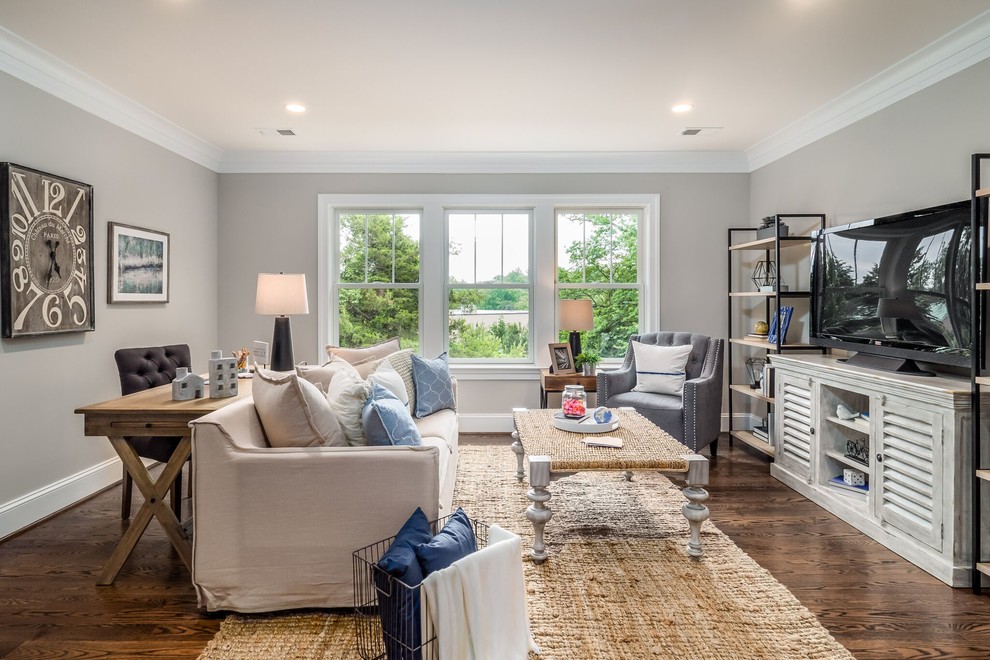 Inspiration for a large craftsman open concept dark wood floor and brown floor family room remodel in DC Metro with gray walls, no fireplace and a tv stand