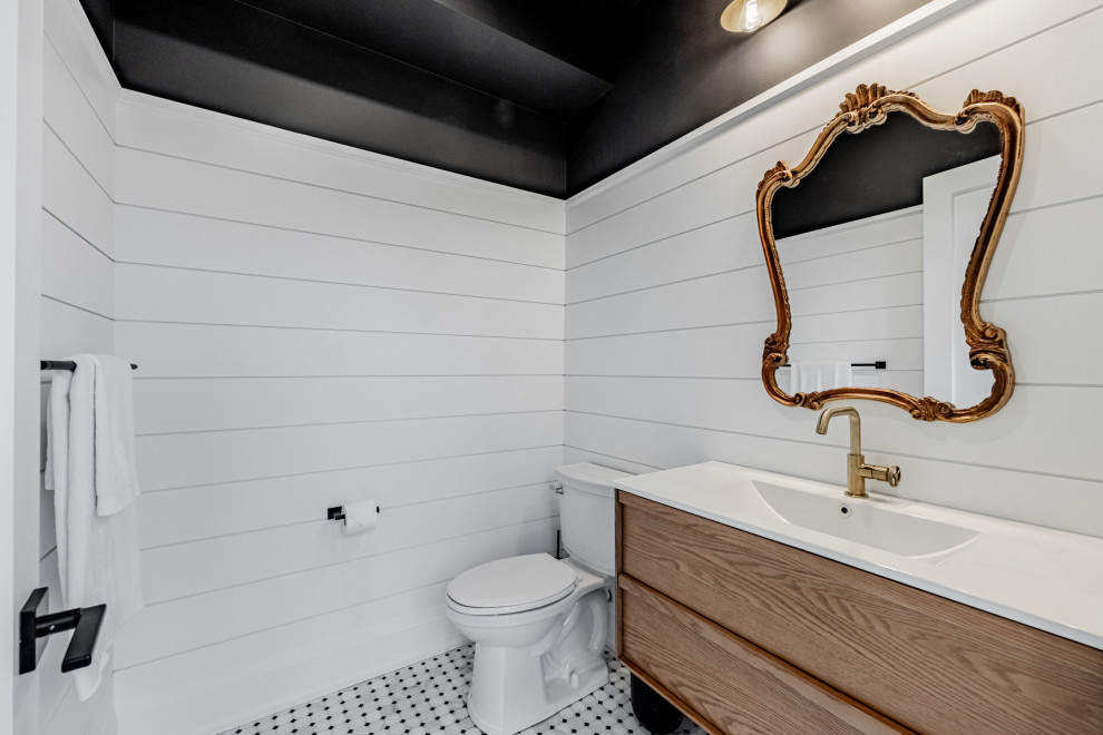 Small farmhouse shower room bathroom in Toronto with flat-panel cabinets, beige cabinets, a two-piece toilet, white walls, marble flooring, solid surface worktops, multi-coloured floors, white worktops, a single sink and a floating vanity unit.