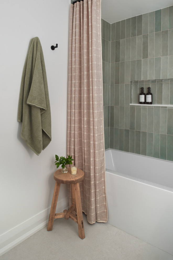 Small transitional green tile and porcelain tile porcelain tile, beige floor, single-sink and wainscoting bathroom photo in Toronto with shaker cabinets, medium tone wood cabinets, a one-piece toilet, white walls, an undermount sink, quartz countertops, white countertops, a niche and a freestanding vanity