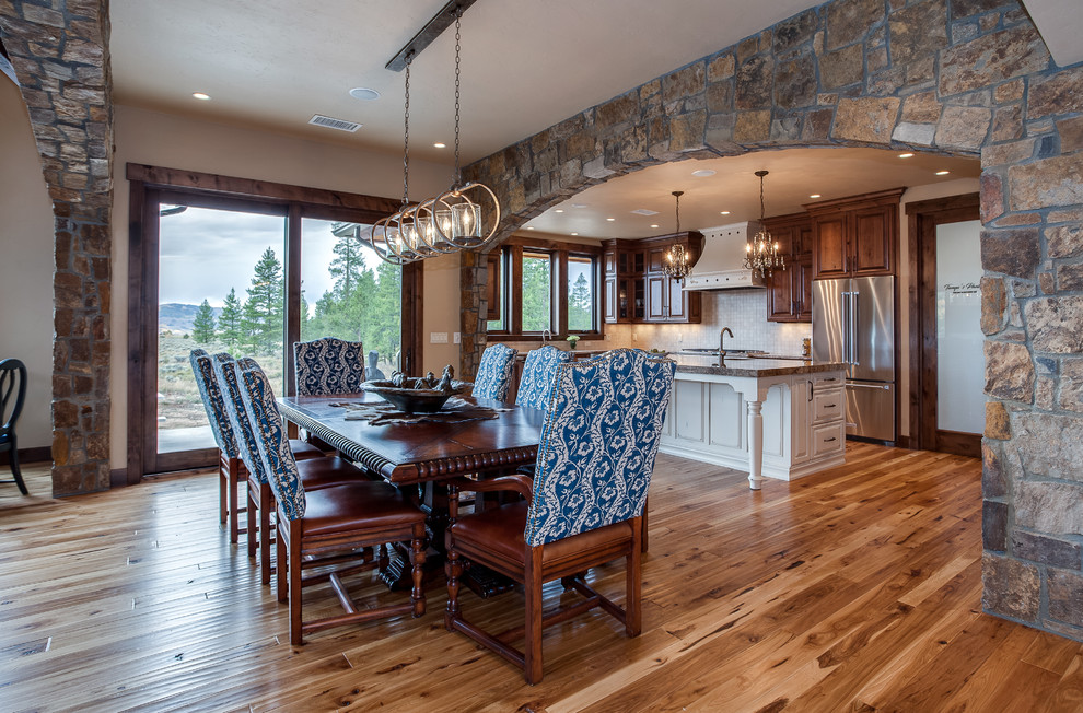 Inspiration for an expansive country dining room in Denver with medium hardwood floors and brown floor.