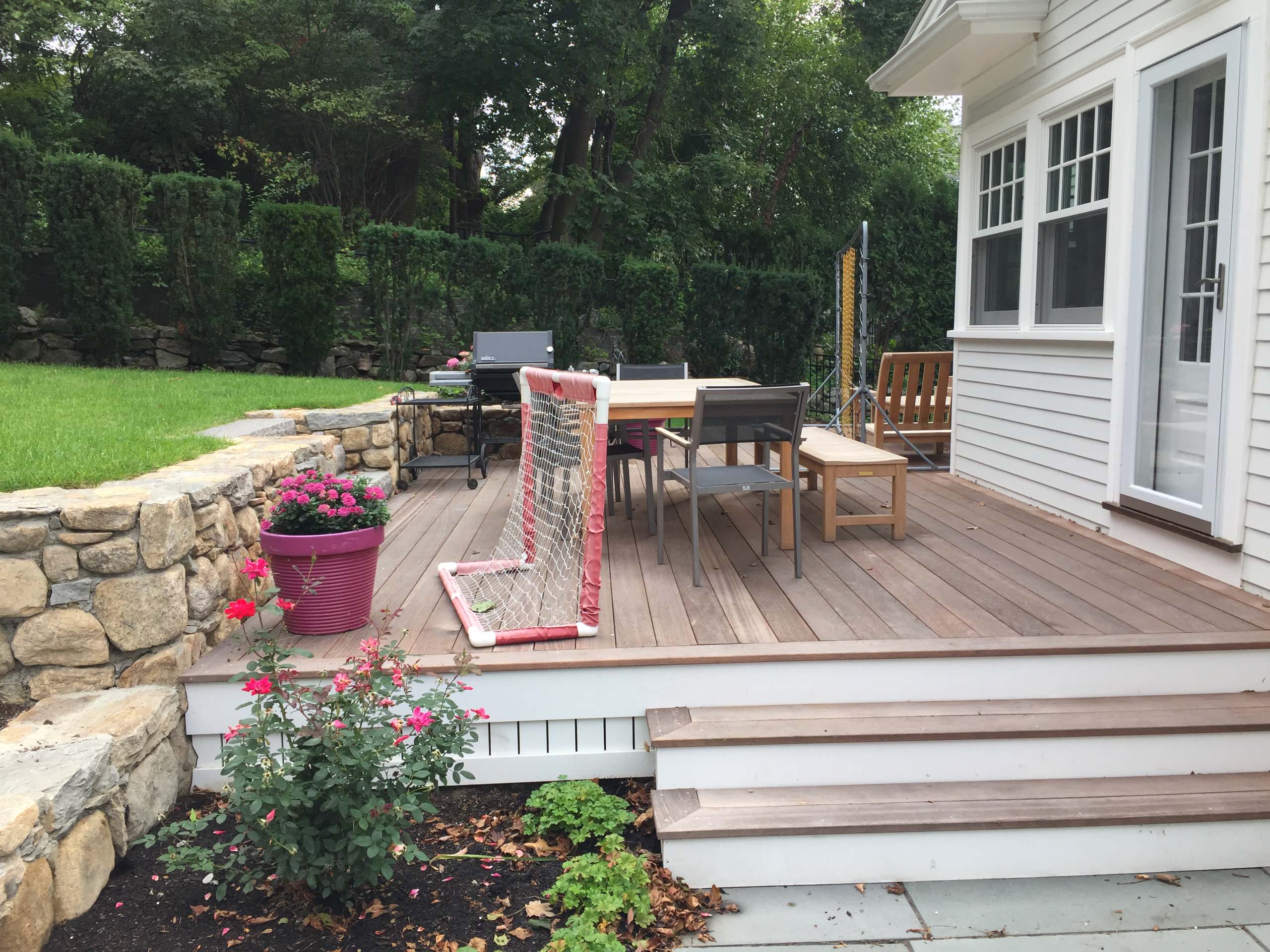deck connects kitchen to upper lawn