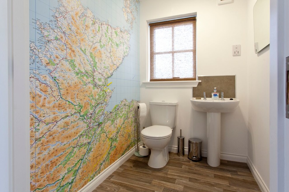 Mid-sized contemporary powder room in Other with a pedestal sink, a two-piece toilet, porcelain tile, white walls and vinyl floors.