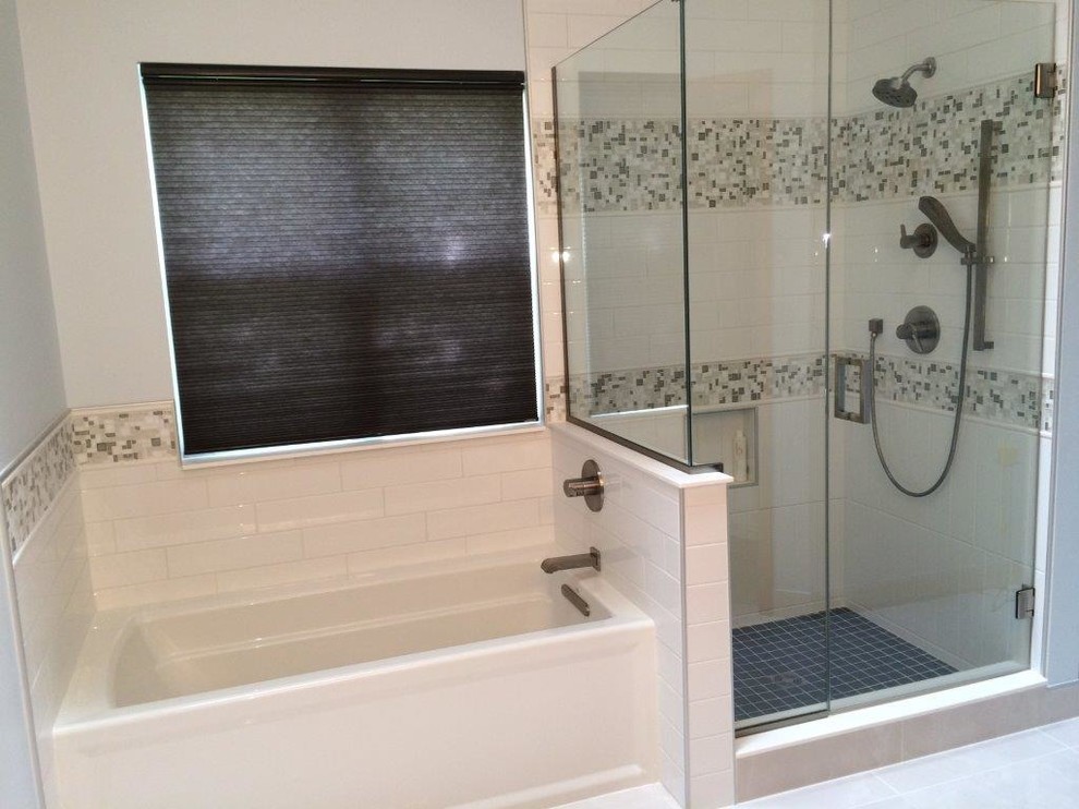 Mid-sized transitional master bathroom in Indianapolis with an undermount sink, flat-panel cabinets, dark wood cabinets, solid surface benchtops, an alcove tub, an alcove shower, ceramic tile and ceramic floors.