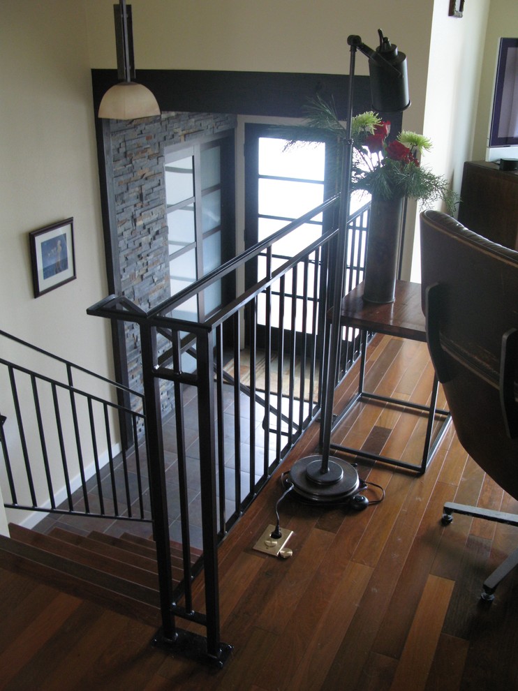 Inspiration for a mid-sized transitional porcelain tile staircase remodel in Seattle with white walls and a glass front door