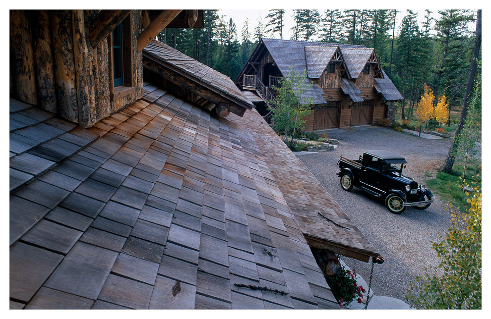 Patio - mid-sized rustic two-story wood brown patio idea