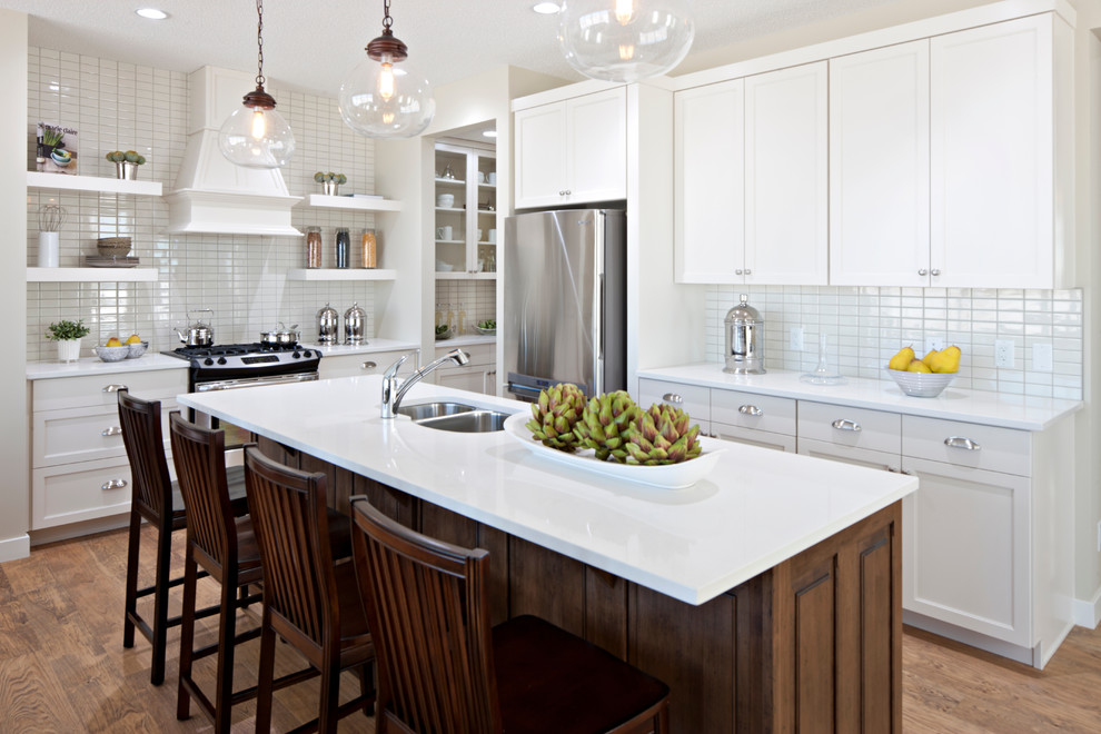Inspiration for a traditional kitchen in Calgary with stainless steel appliances.