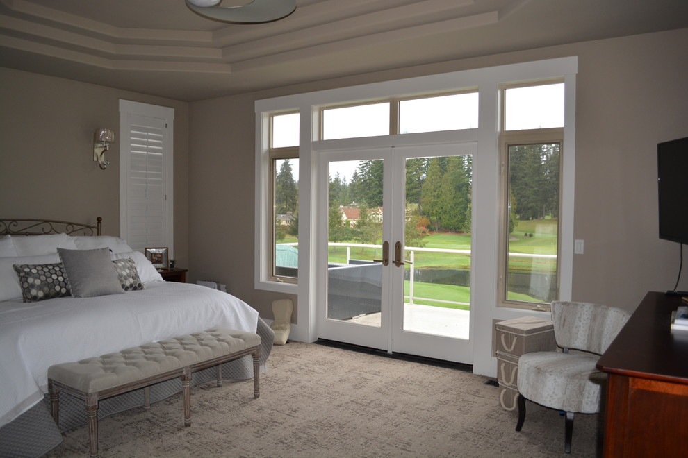 Large transitional master bedroom in Seattle with beige walls, carpet and beige floor.