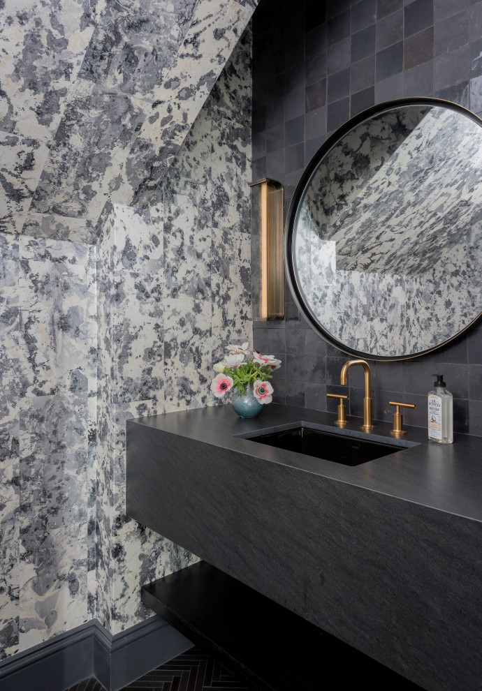Design ideas for a mid-sized transitional powder room in Boston with black cabinets, a two-piece toilet, black tile, terra-cotta tile, black walls, ceramic floors, an undermount sink, granite benchtops, black floor, black benchtops, a floating vanity, vaulted and wallpaper.
